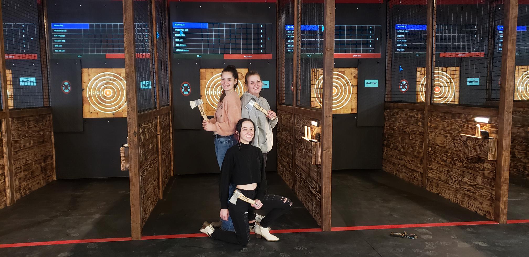 Marysville axe throwing women in front of projected target