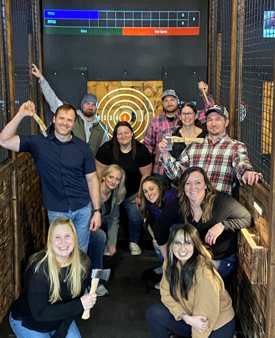 Marysville axe throwers at special event in front of projected lane
